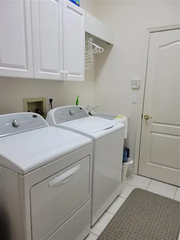 a view of a dining room with furniture wooden floor and a potted plant