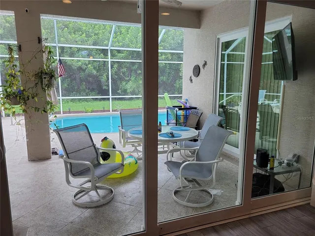 a view of an empty room with glass door