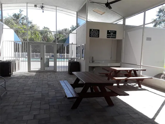 a view of a swimming pool with a yard