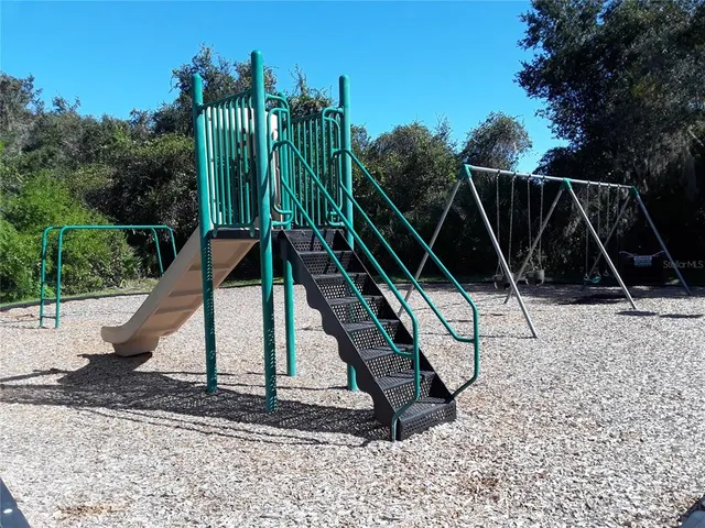 a view of house with a yard