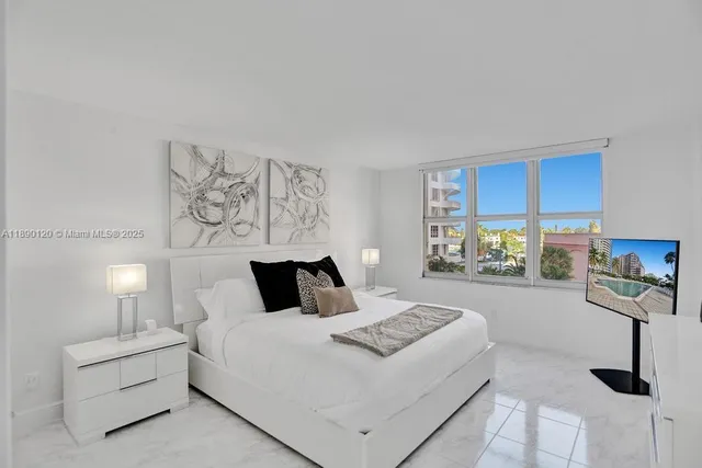 a bedroom with a bed and a lamp with window