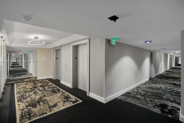 a view of a livingroom with wooden floor and a window