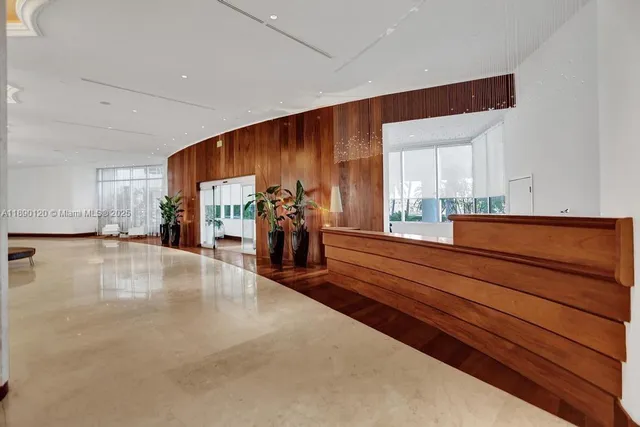 a very nice looking room with wooden floor and furniture