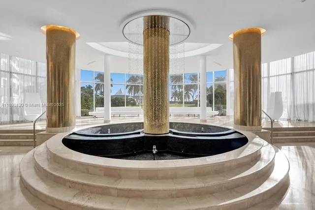 a kitchen with stainless steel appliances granite countertop a table and chairs