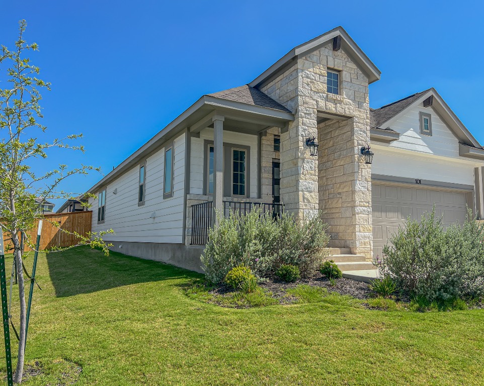 a front view of a house with a yard