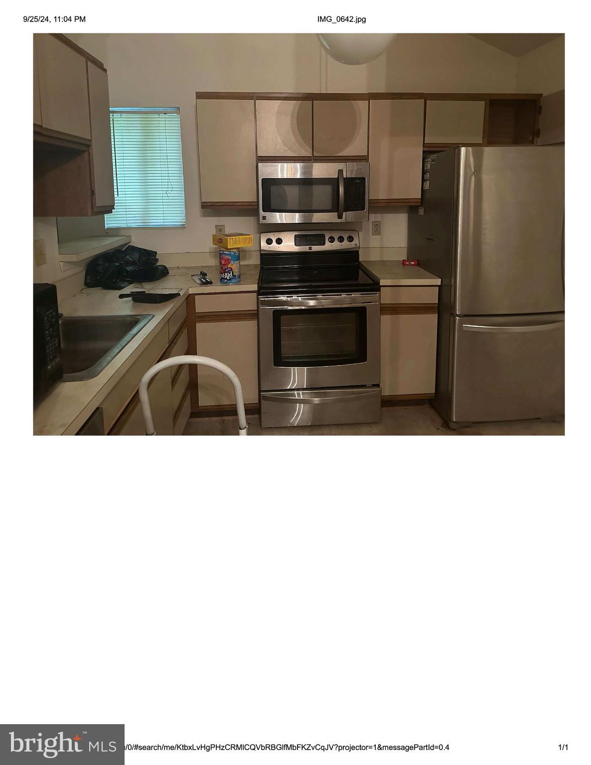4524 St Thomas Avenue Baltimore, MD 21206 - Photo 3 of 7 a kitchen with a sink a stove and refrigerator