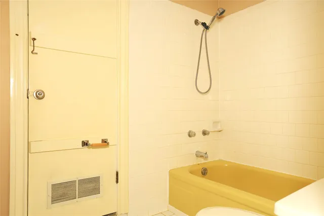 a bathroom with a bath tub