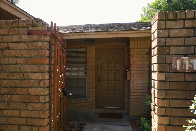 a bathroom with a shower and a sink