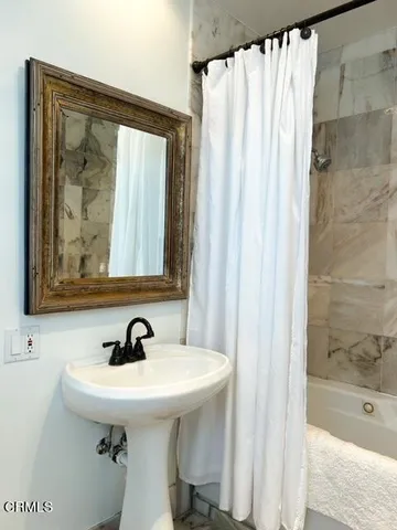 a bedroom with a bed and a table