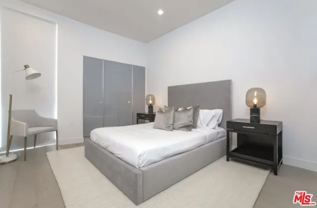 a bathroom with a shower sink and mirror