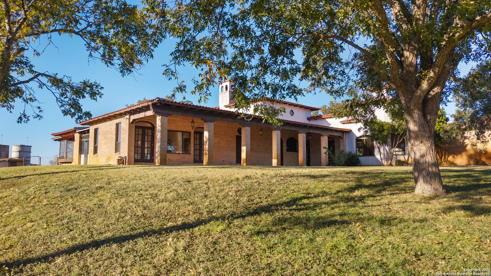 2650 Bandera Highway Kerrville, TX 78028 - Photo 16 of 50 a front view of a house with a garden