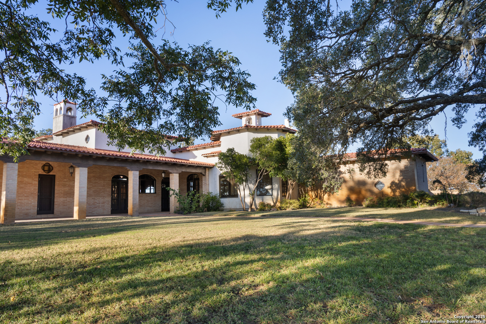 2650 Bandera Highway Kerrville, TX 78028 - Photo 17 of 50 a front view of a house with a yard