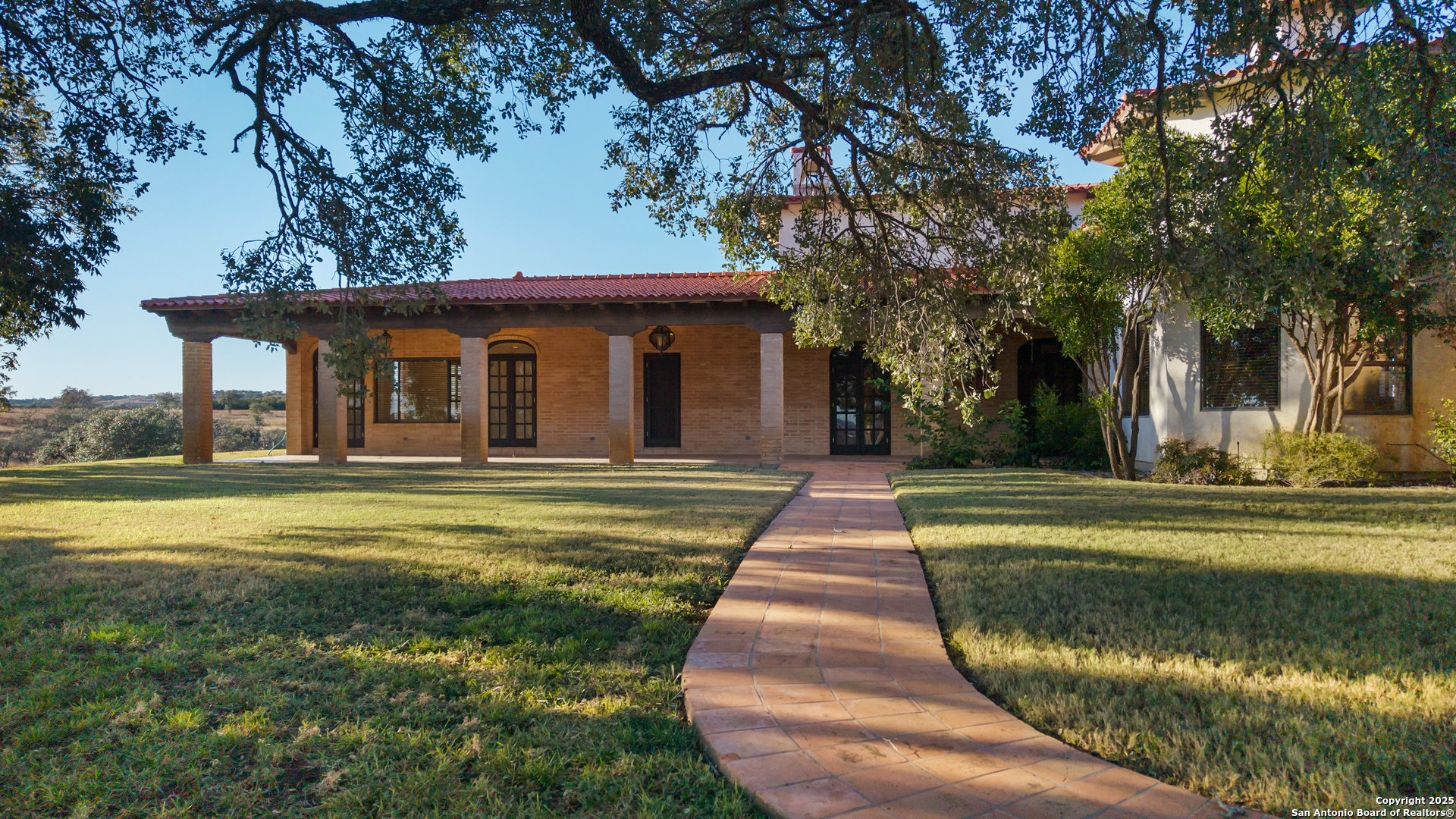 2650 Bandera Highway Kerrville, TX 78028 - Photo 19 of 50 a front view of a house with a yard