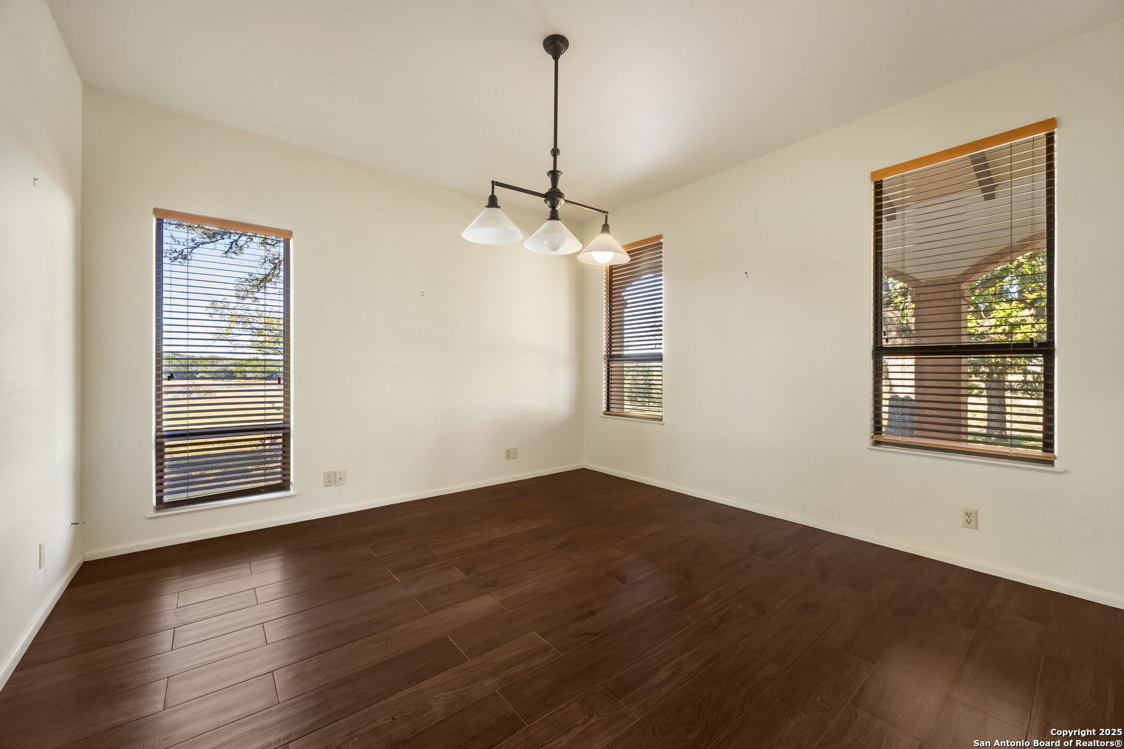 2650 Bandera Highway Kerrville, TX 78028 - Photo 32 of 50 a view of a room with wooden floor fan and windows