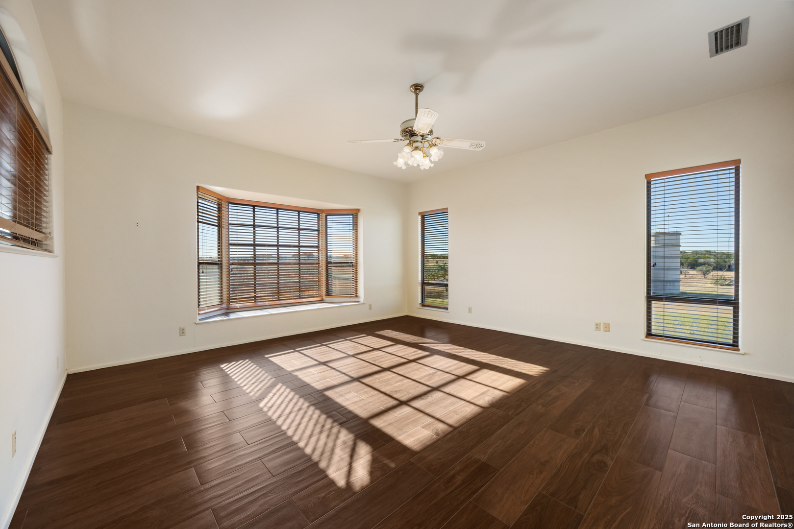 2650 Bandera Highway Kerrville, TX 78028 - Photo 36 of 50 a view of an empty room with a window and wooden floor