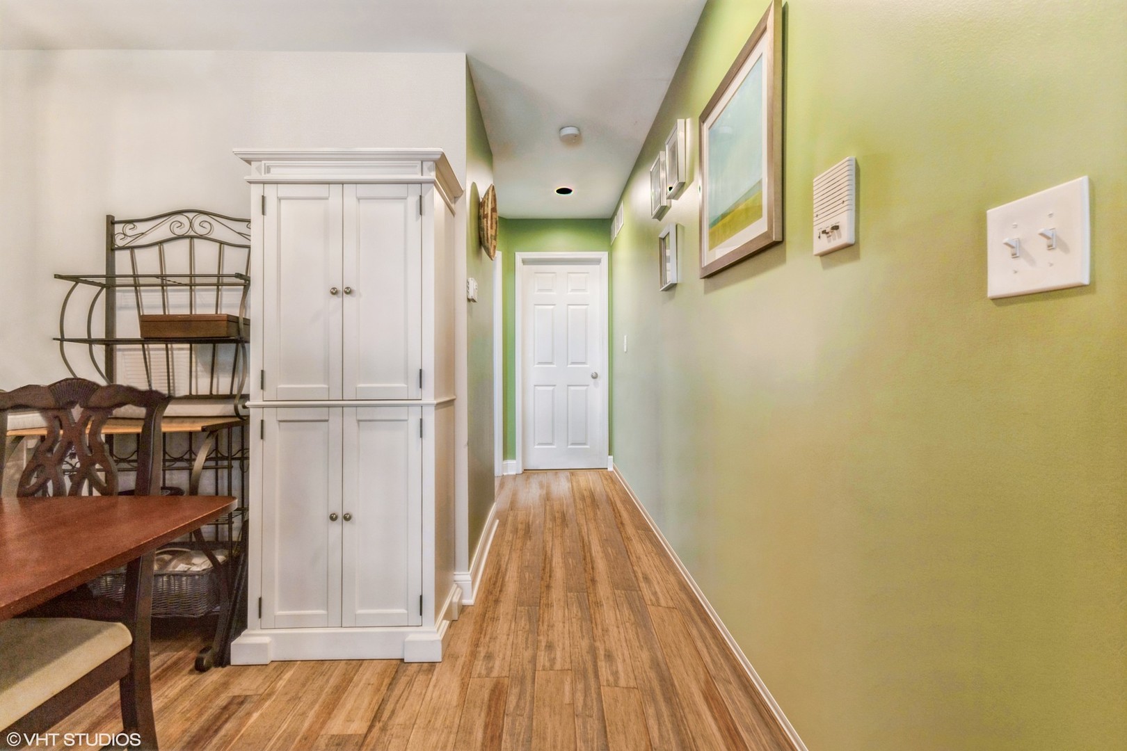 1328 South Federal Street, Unit G Chicago, IL 60605 - Photo 12 of 27 a view of a hallway with wooden floor and staircase