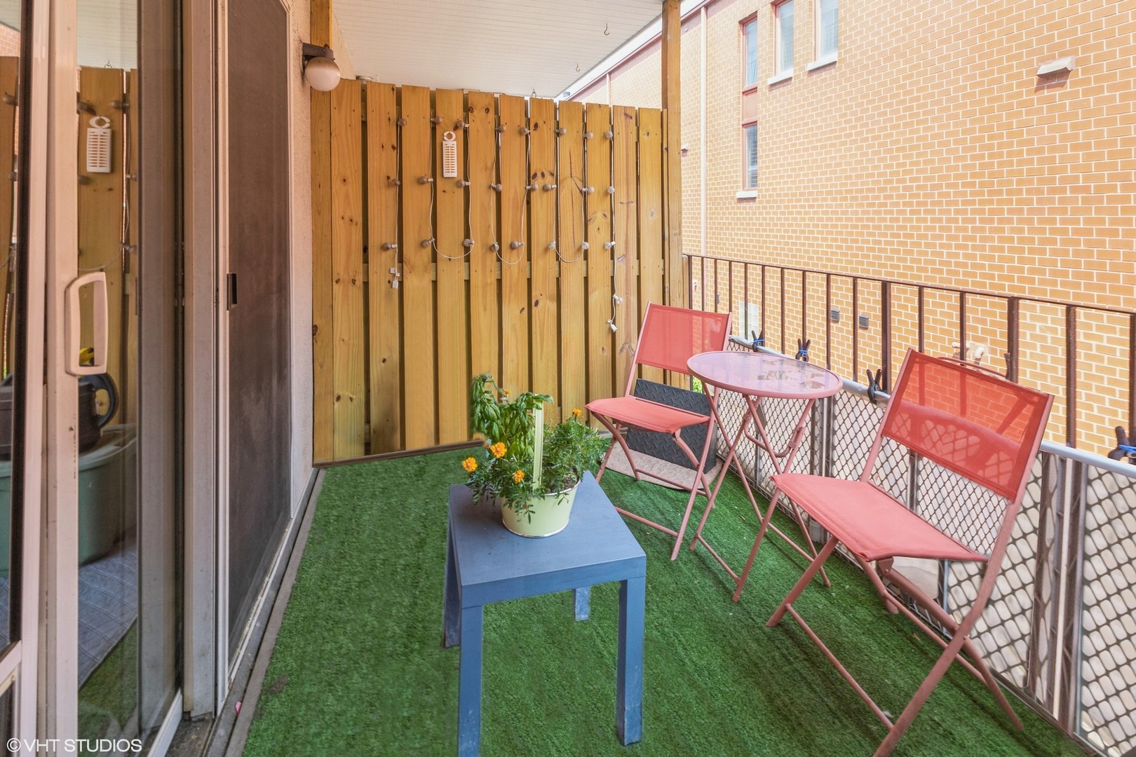 1328 South Federal Street, Unit G Chicago, IL 60605 - Photo 14 of 27 a balcony with chairs and a table