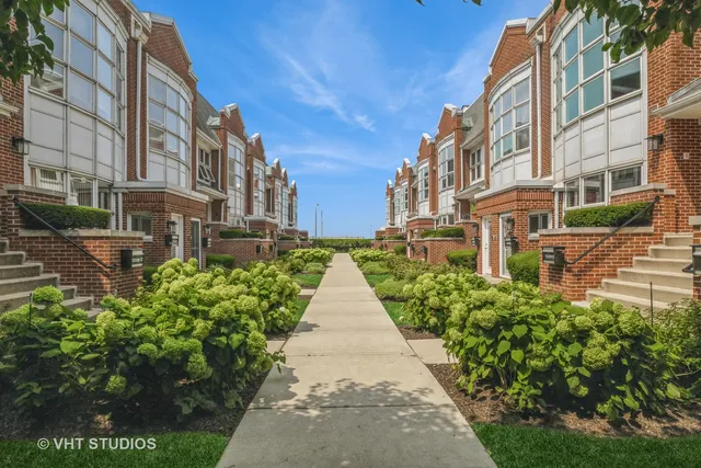 a view of a pathway with a buildings in the background