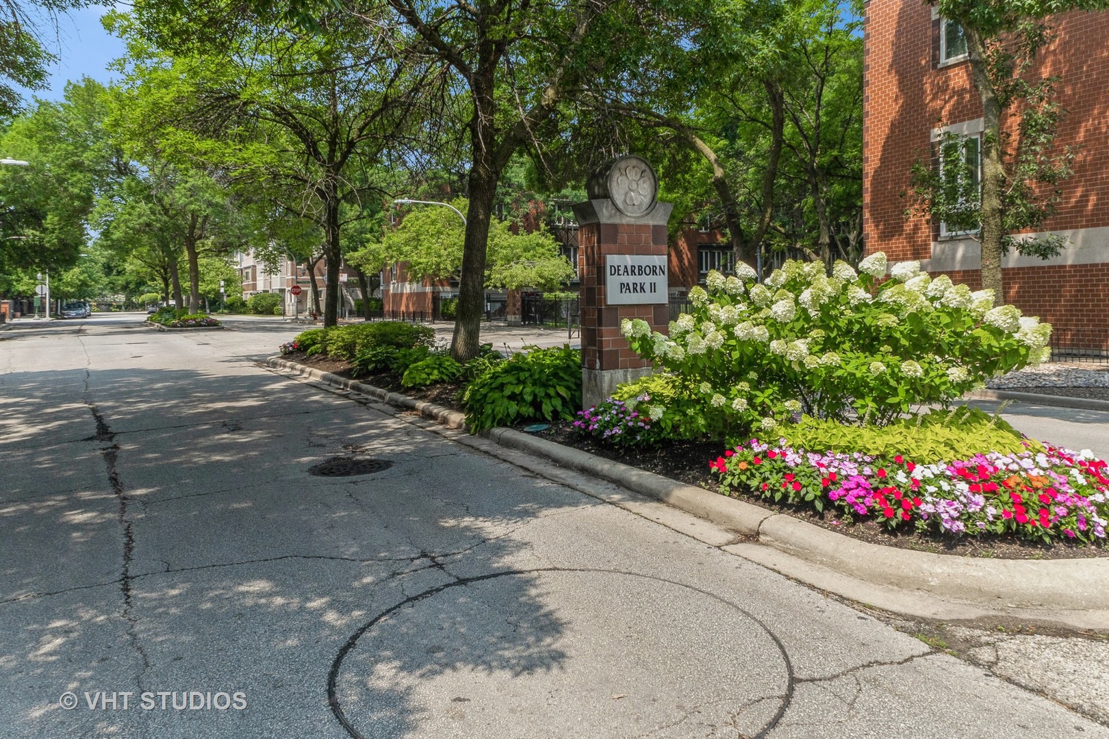 1328 South Federal Street, Unit G Chicago, IL 60605 - Photo 23 of 27 a street view with a bench and trees