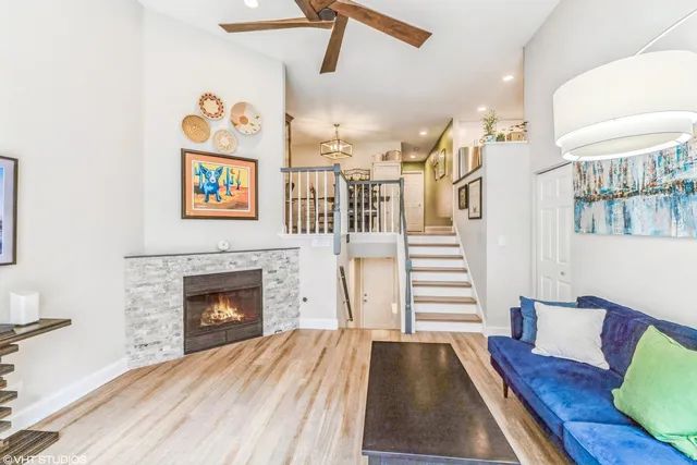 a living room with furniture and a fireplace