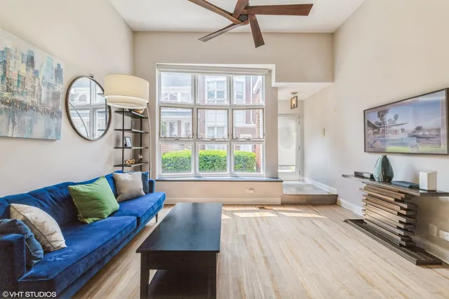 a living room with furniture and a large window