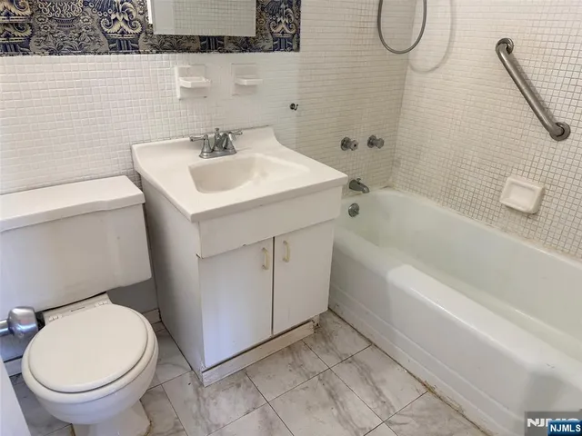 a couple of table and chairs in front of building