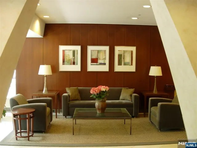 a living room with lots of furniture and a flat screen tv