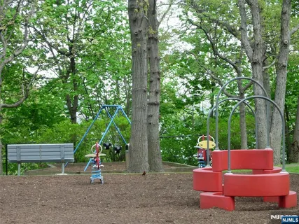 a view of outdoor space with seating area and trees around