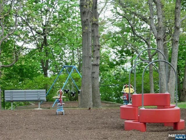 a view of outdoor space with seating area and trees around