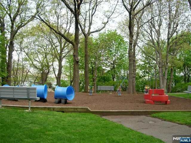 a view of outdoor space with garden and trees