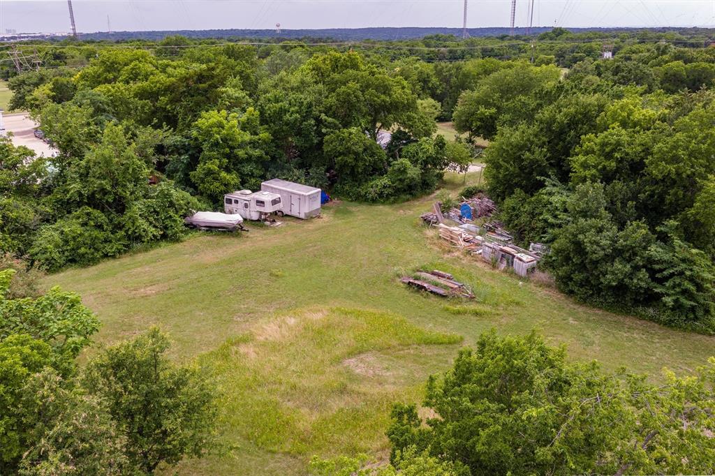 1007 West Belt Line Road Cedar Hill, TX 75104 - Photo 12 of 30 Expansive wooded lot featuring a large grassy clearing and mature trees
