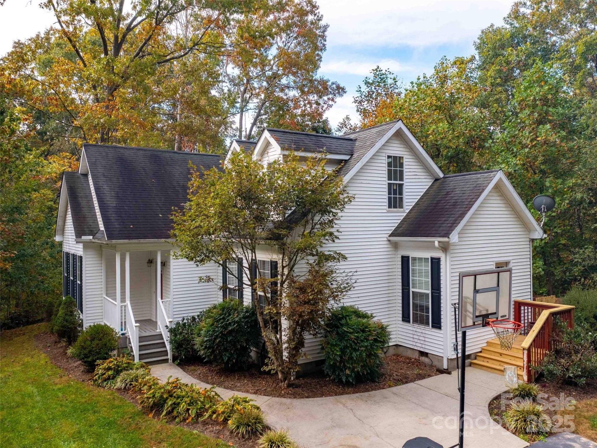 37 C Creek Lane Pisgah Forest, NC 28768 - Photo 1 of 34 a front view of a house with garden