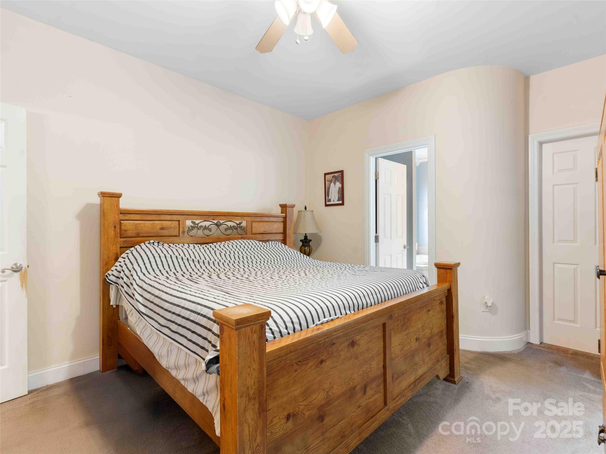 37 C Creek Lane Pisgah Forest, NC 28768 - Photo 17 of 34 a bedroom with a bed and a dresser