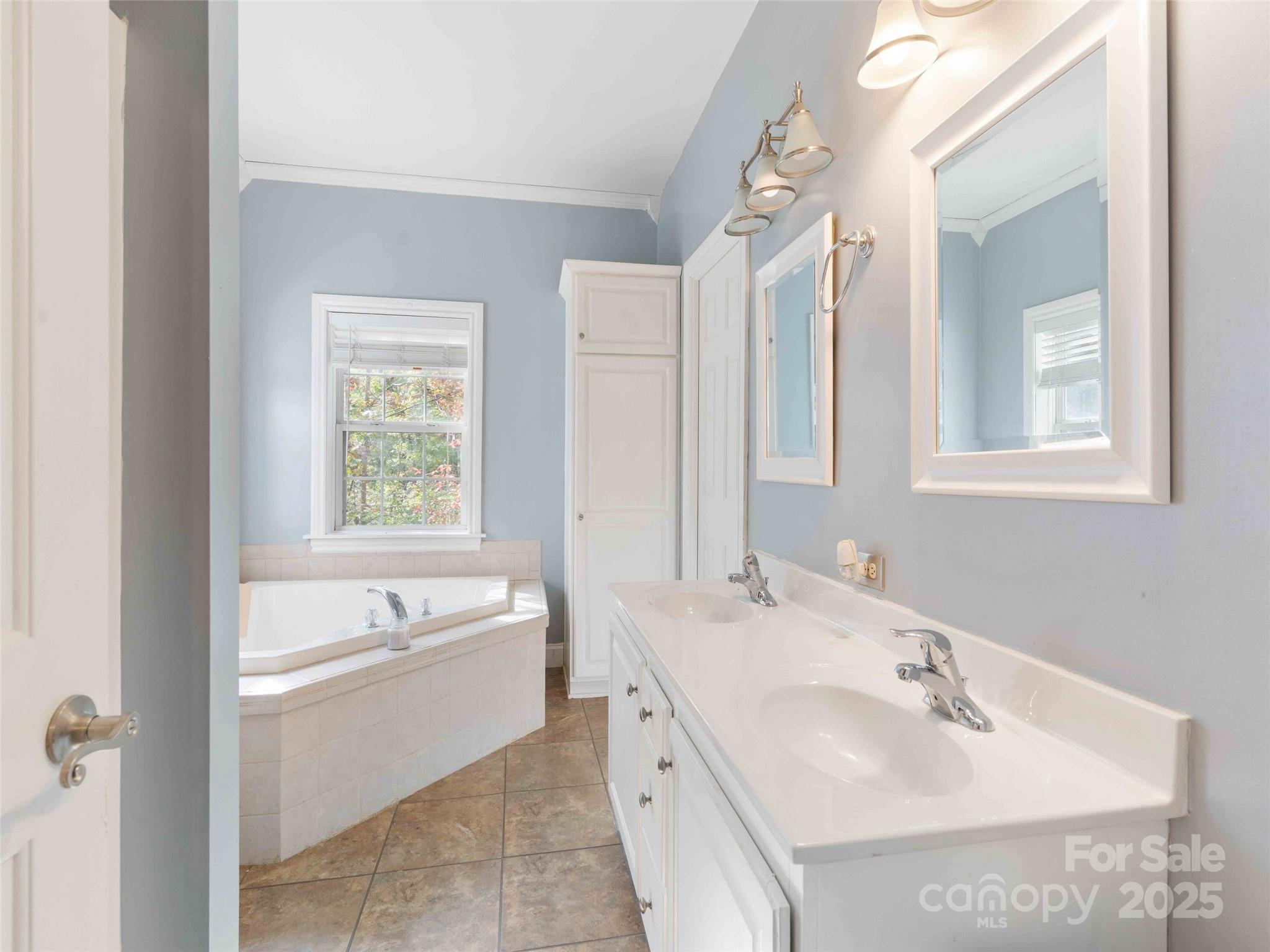37 C Creek Lane Pisgah Forest, NC 28768 - Photo 18 of 34 a bathroom with a tub sink and mirror