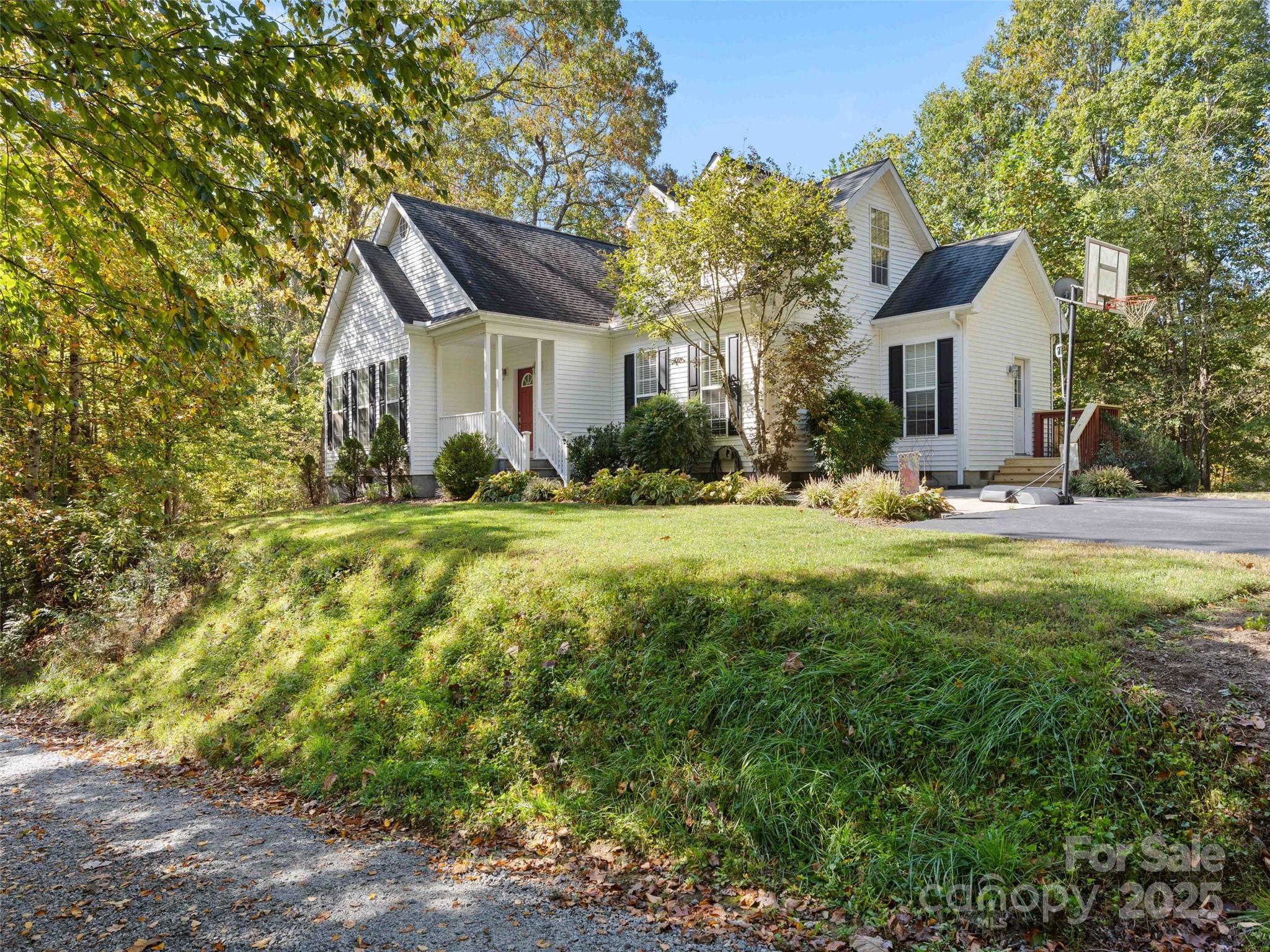 37 C Creek Lane Pisgah Forest, NC 28768 - Photo 32 of 34 a front view of a house with a yard