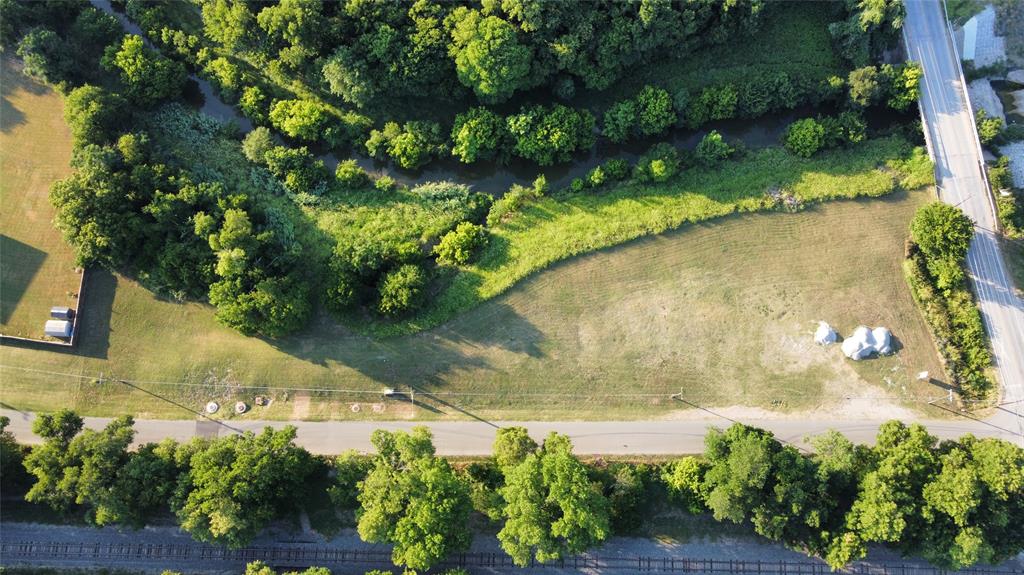 8040 Barbaree Boulevard Dallas, TX 75228 - Photo 3 of 4 a view of a lake with a yard