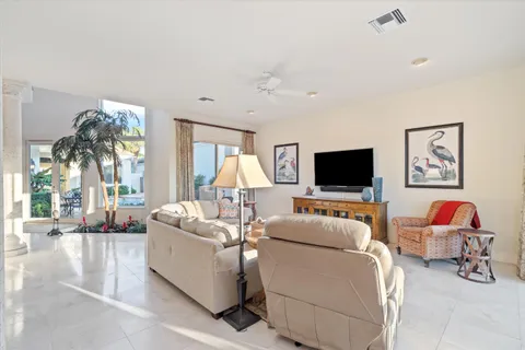 a kitchen with stainless steel appliances granite countertop a sink and a refrigerator