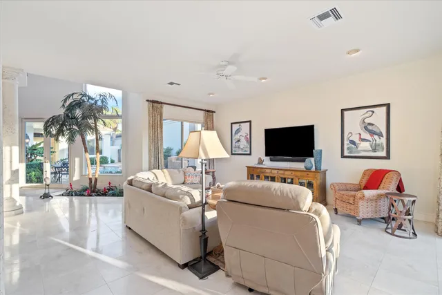 a kitchen with stainless steel appliances granite countertop a sink and a refrigerator