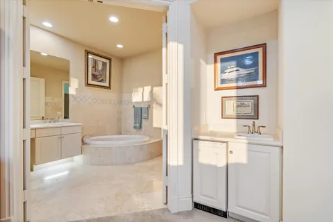 a view of a balcony with furniture and a floor to ceiling window