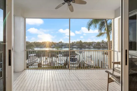 a view of a chairs and table in patio with a yard