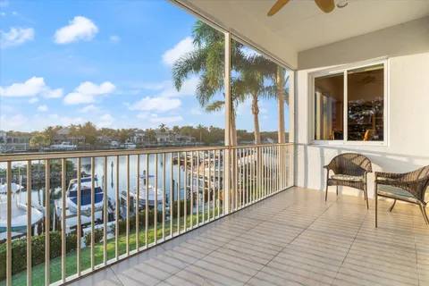 a view of a lake with houses in the back
