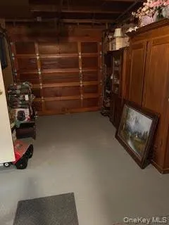 a view of walk in closet with clothes