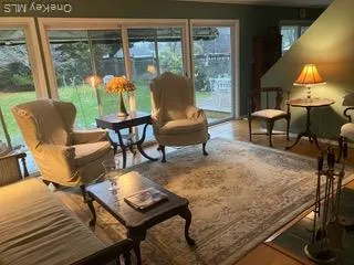 a living room with furniture and a lamp