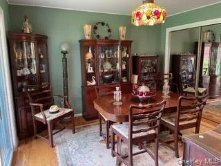 a room with musical instrument pool table and windows