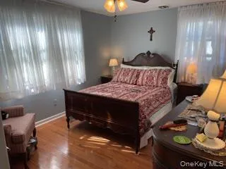 a bedroom with bed and a chandelier