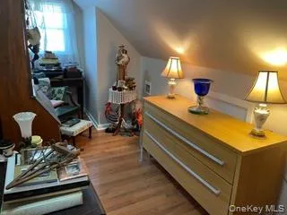 a room with furniture and lamp on desk