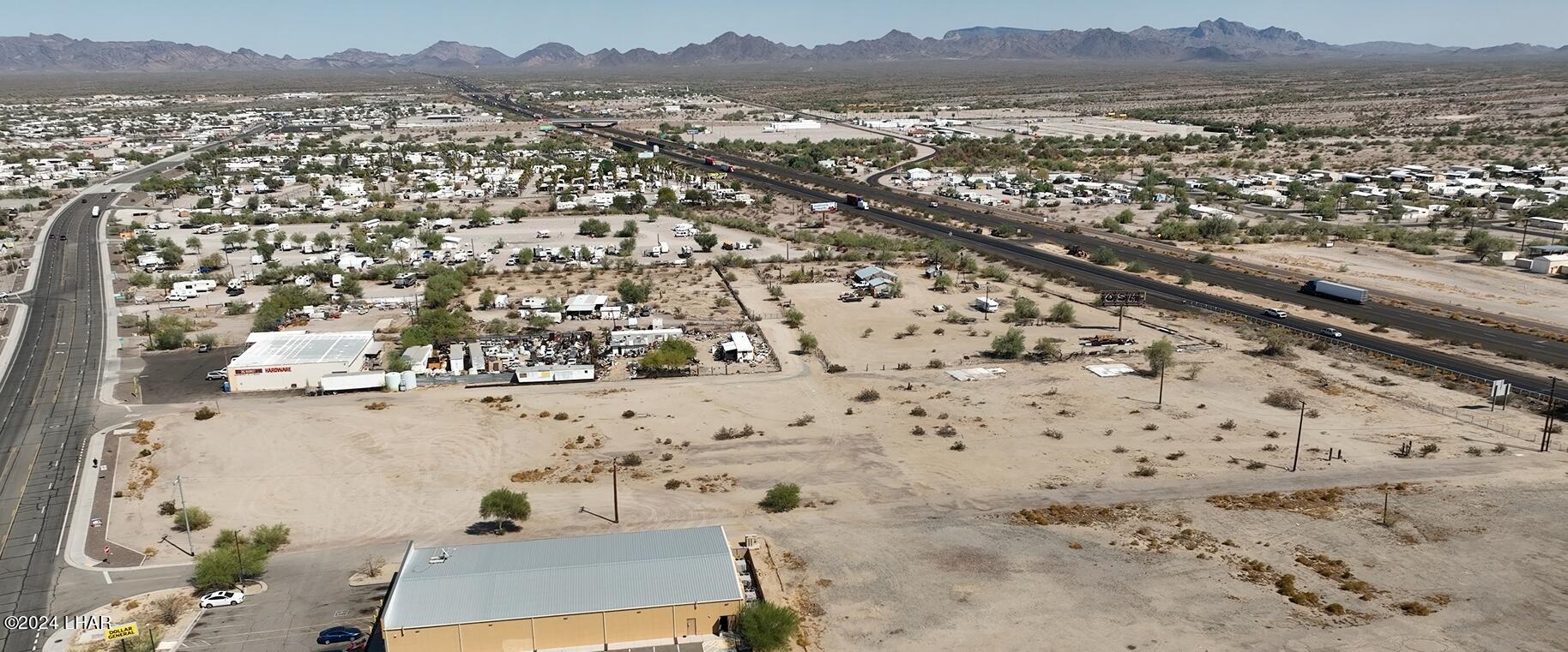 815 West Main Street Quartzsite, AZ 85346 - Photo 6 of 12 an aerial view of residential house and wooden fence