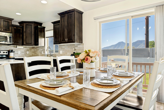 983 West 1550th Street South Springville, UT 84663 - Photo 17 of 43 Dining area with wood-finish flooring and a sliding glass door.