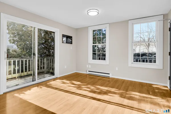 a view of an empty room with a window