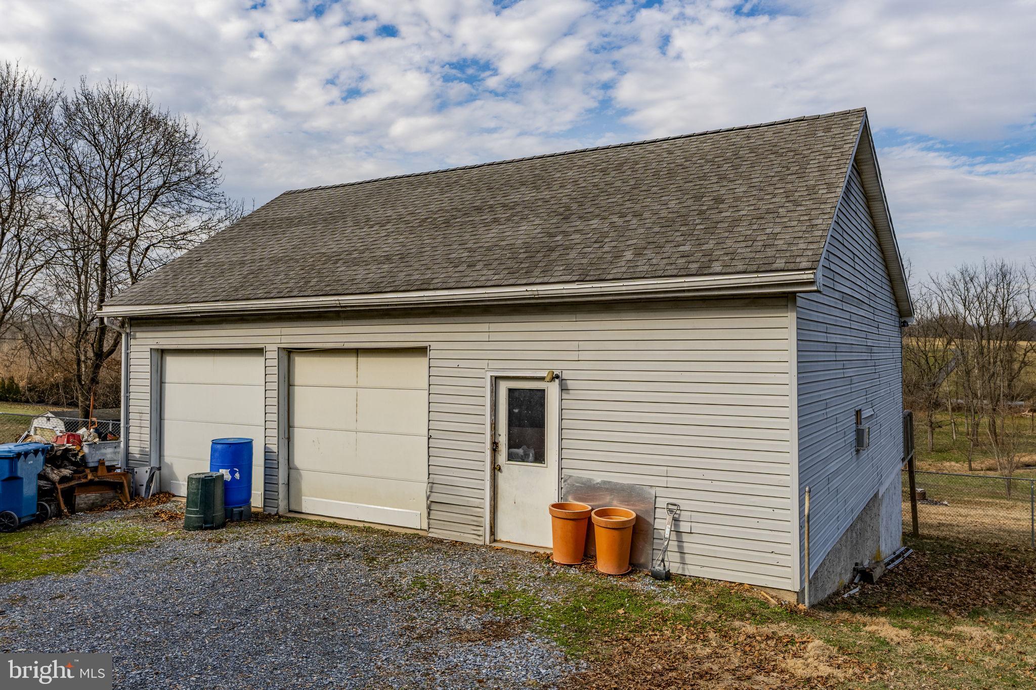 89 Cross Key Road Bernville, PA 19506 - Photo 16 of 20 a view of a house with a barbeque and wooden fence
